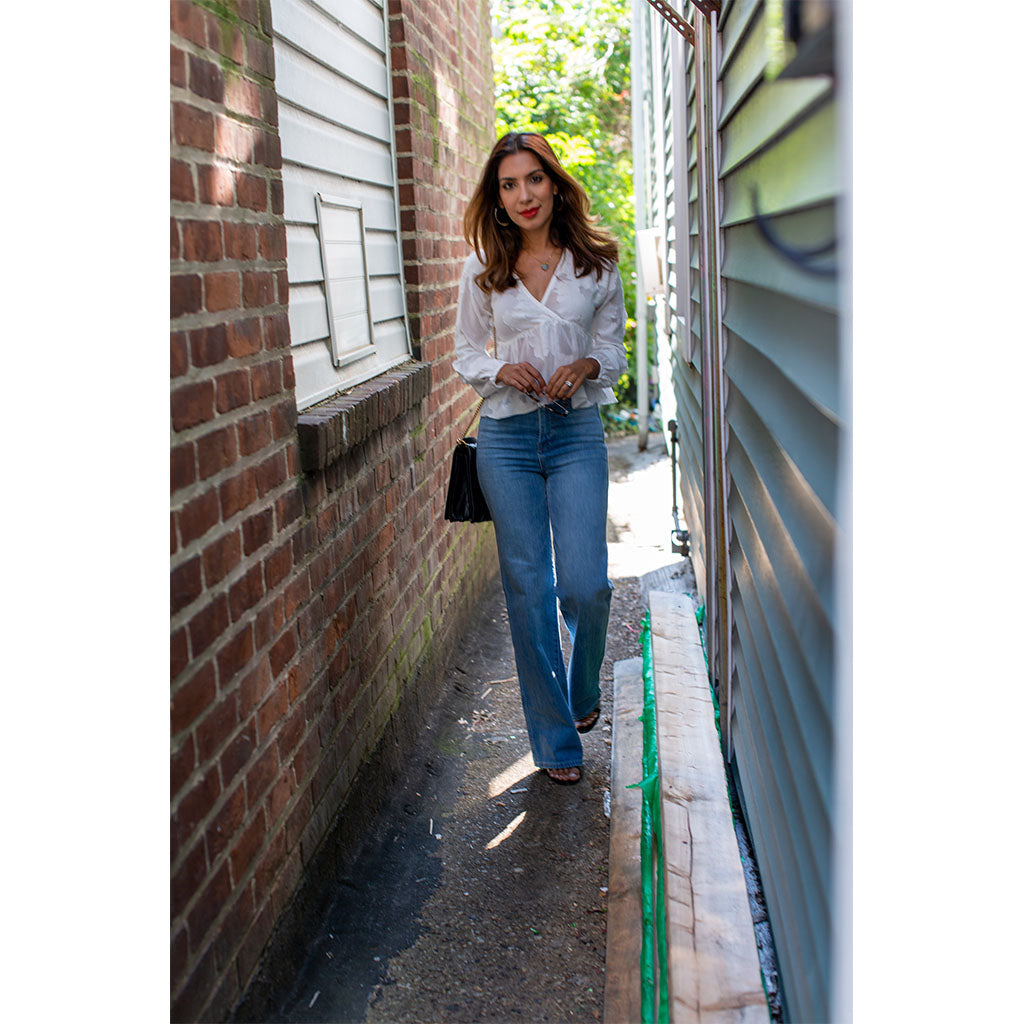 Women in casual shirt and denim