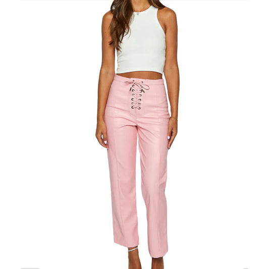 Women in pink leather pants