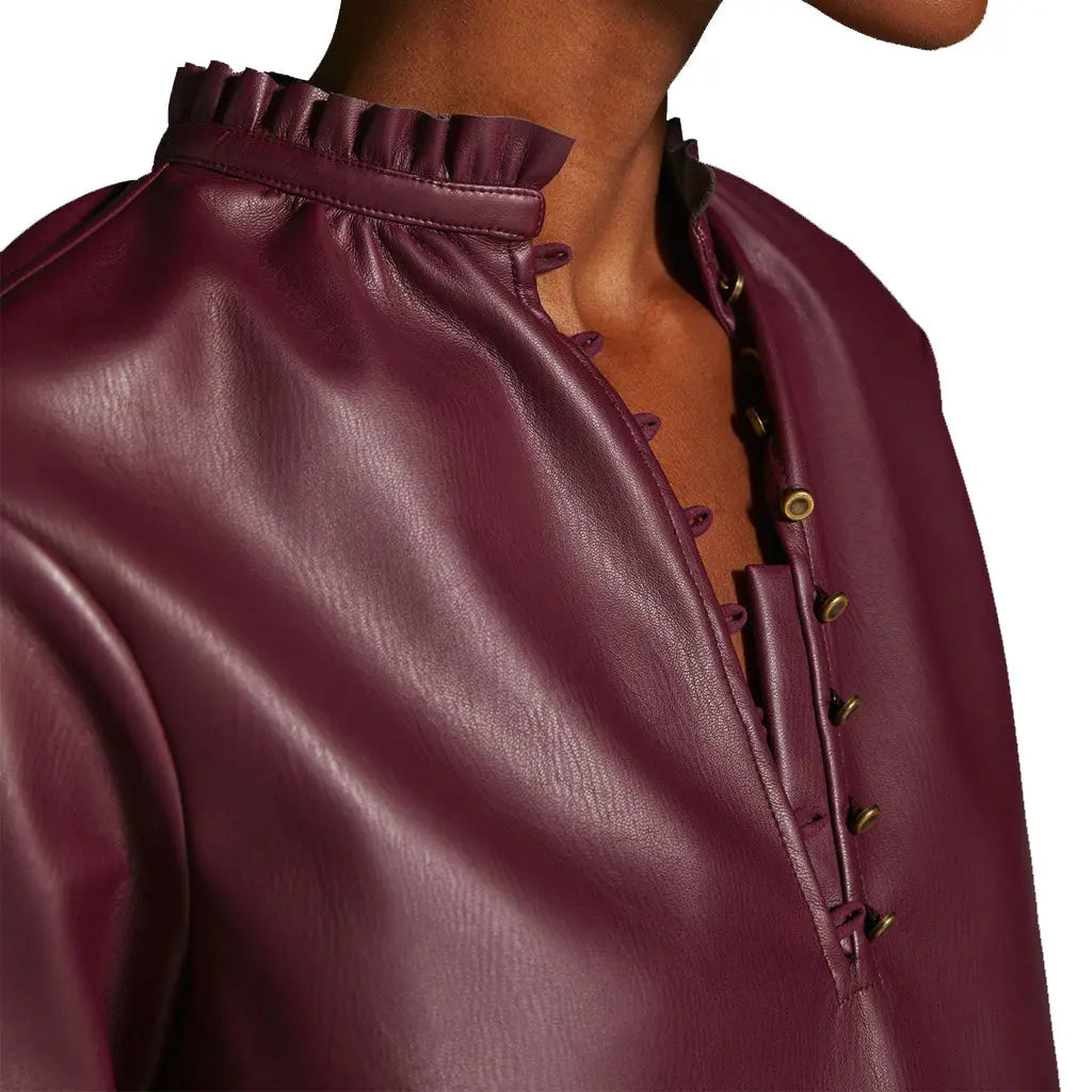 Side Look of Young Women Model wearing Ruffled Neckline Vegan Leather Everyday Blouse button Detailing neckline